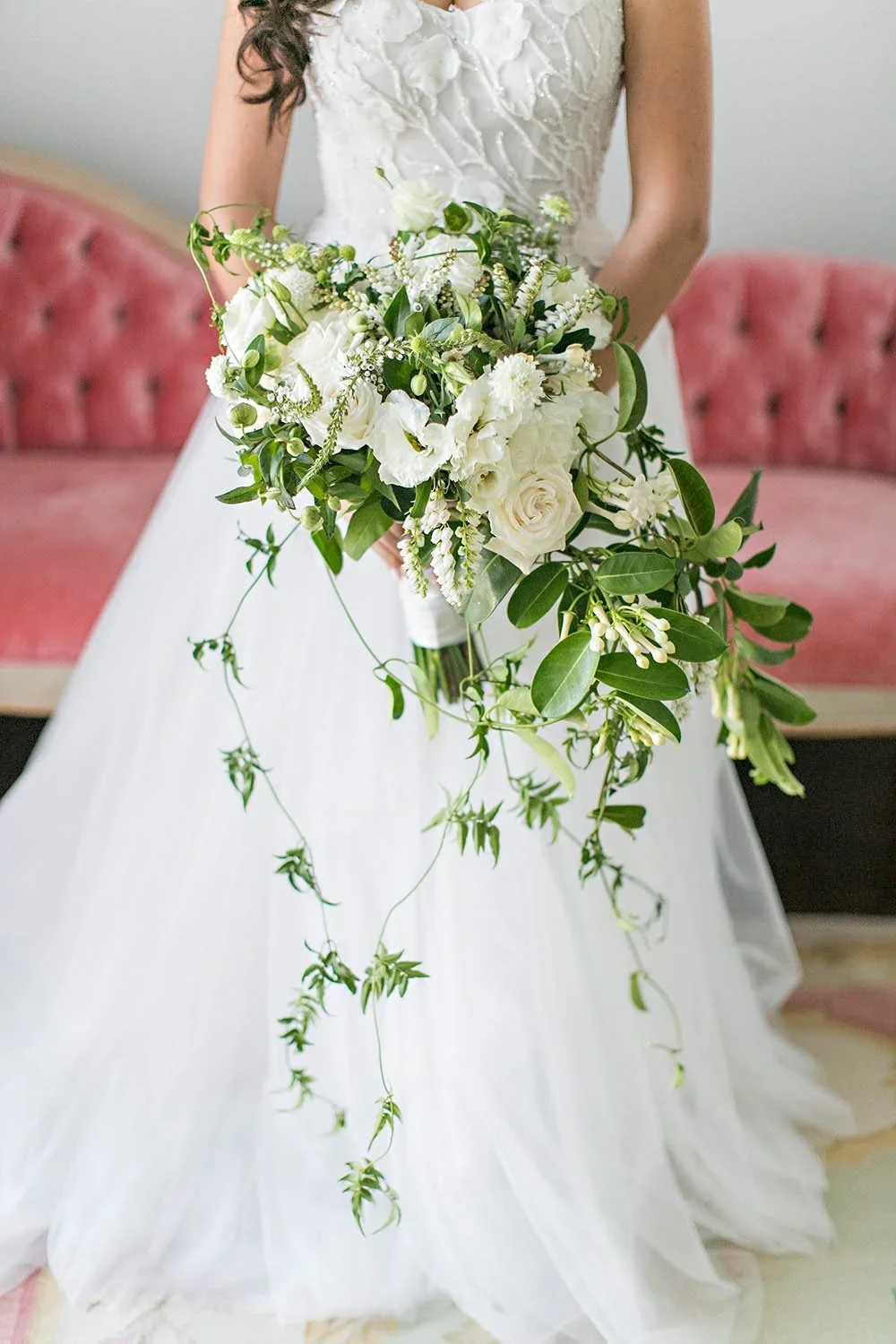 Modern white orchid bridal bouquet by Eddie Zaratsian showcasing sculptural floral form within a Cloud Dancer color palette.