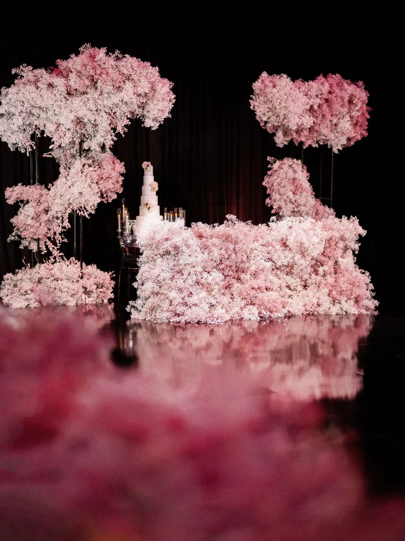 Wedding Cake Table Styled with Soft Florals and Elegant Event Design Elements