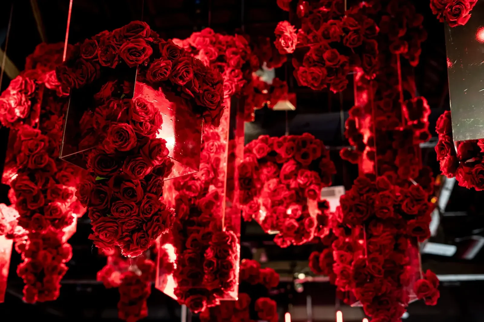 Hanging red rose installation designed by a party planner for a bar mitzvah celebration