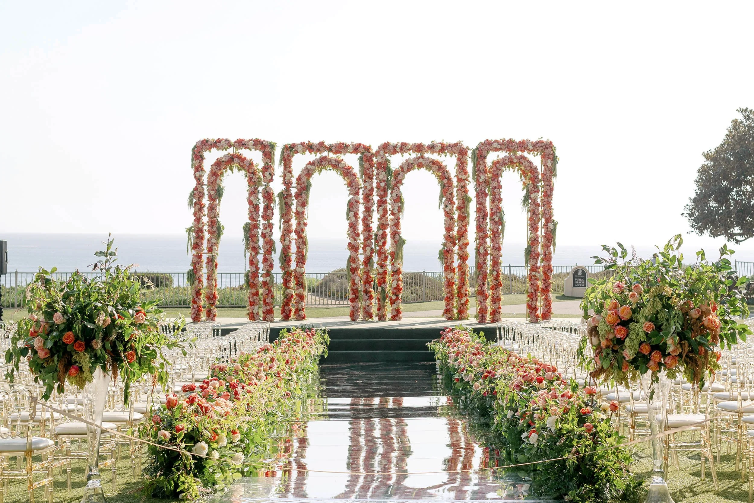 Colorful Summer Wedding Reception with Vibrant Florals and Elevated Coastal Celebration Design