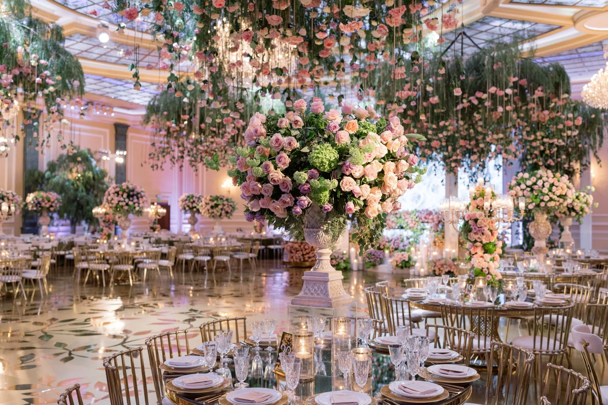 Wedding Reception with a Custom Ceiling Installation of Hanging Florals and Soft Lighting