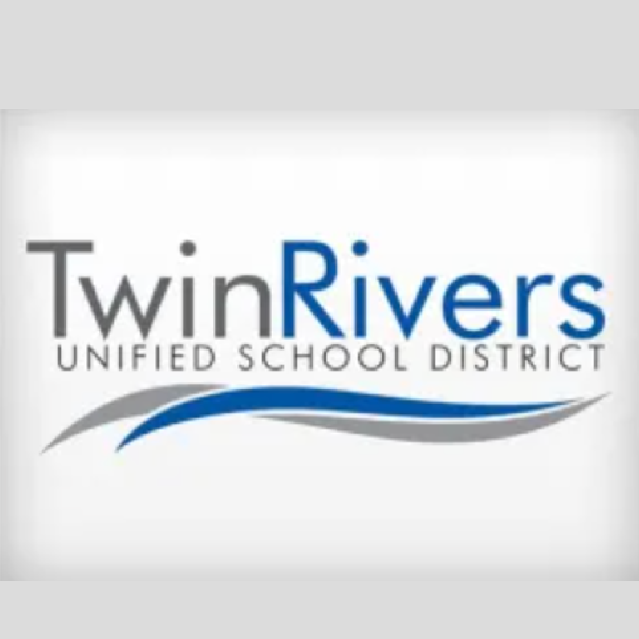 Logo of Twin Rivers Unified School District with black, gray, and blue waves underneath the text