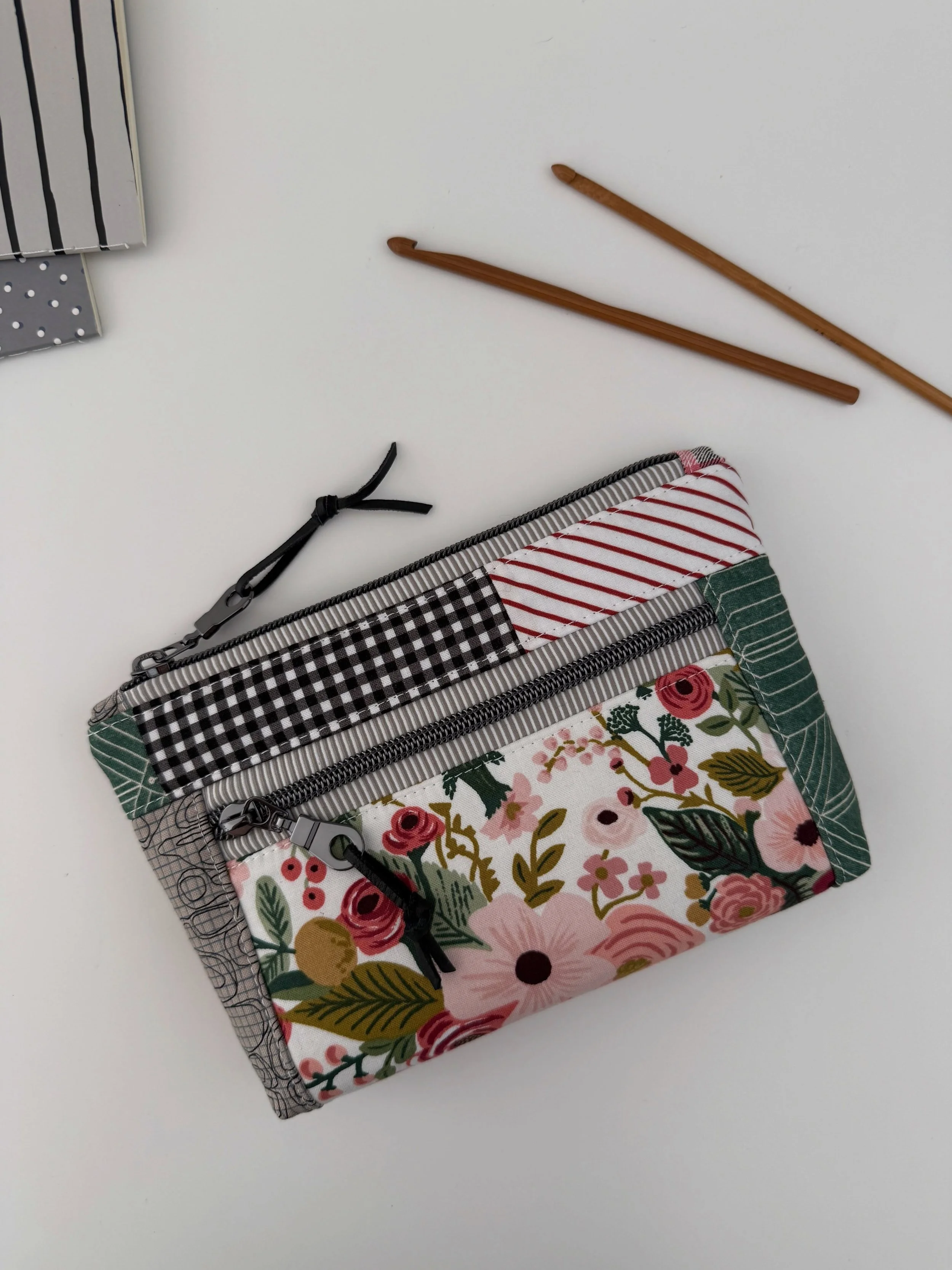 I tried something new and decided to turn some of my favorite scraps of fabric into a Devon Pouch. What do you think? Turned out pretty well, didn&rsquo;t she?

I made a large size of the pouch and combined the scrappy quilting cotton with my favorit