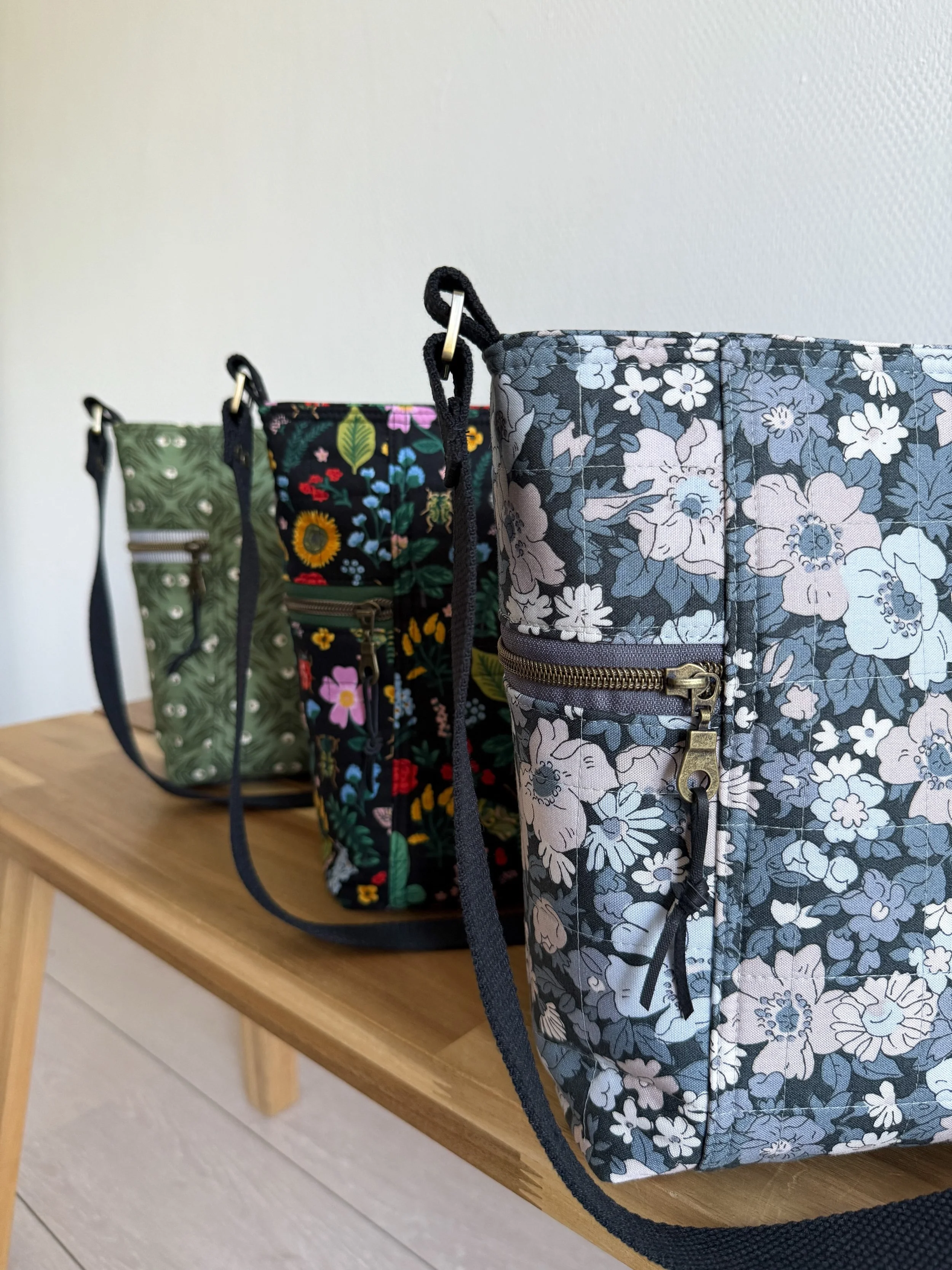 BRAMWELL PURSE ~ a perfect everyday bag featuring two side zipper pockets to keep small essentials within easy reach, additional inner pockets, a main zipper closure that opens nice and wide, and an adjustable shoulder strap. Isn&rsquo;t she quite so
