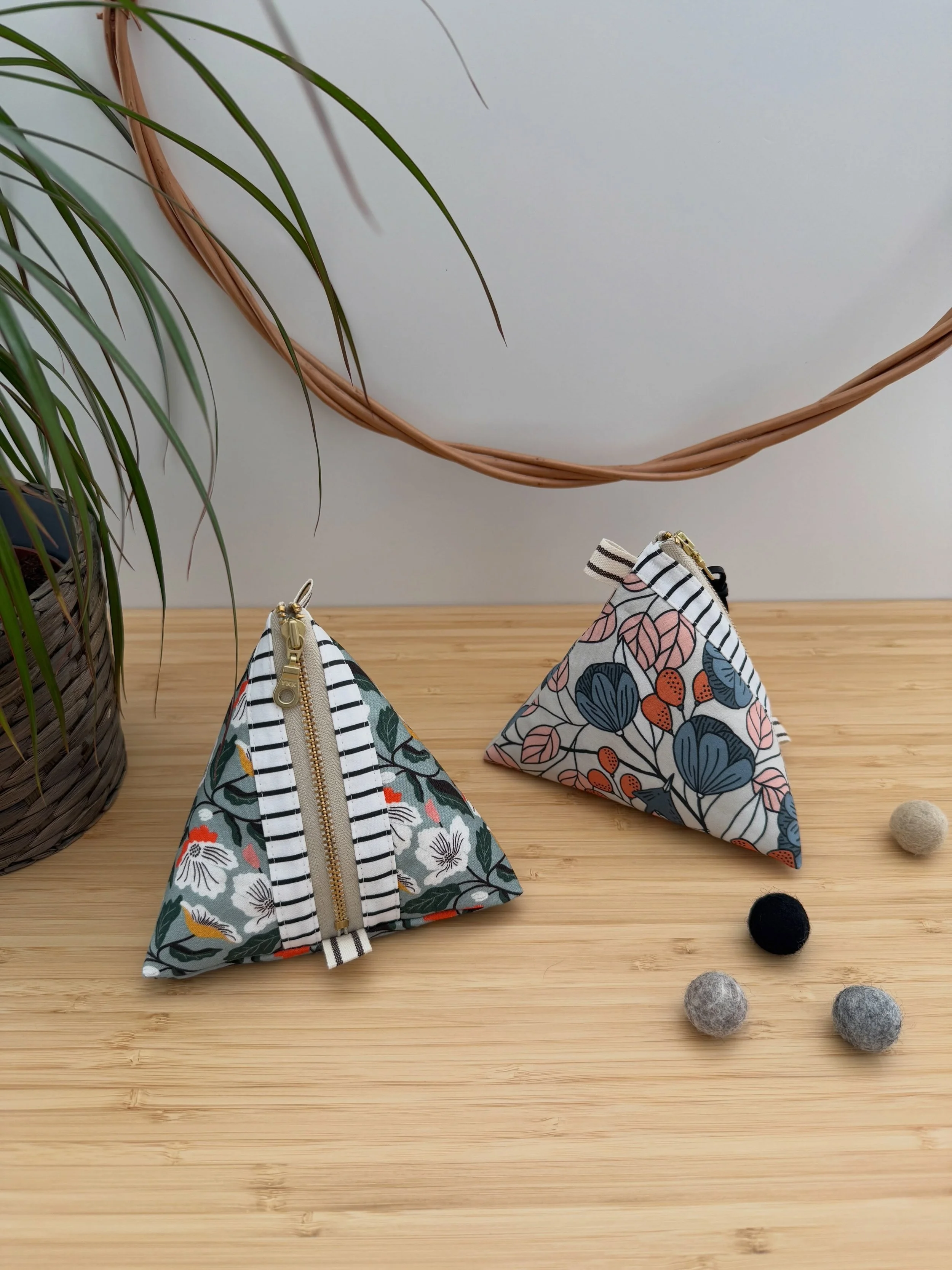 Ready to give the classic zipper pouch a new twist? With their unique triangular shape, these versatile Little Pyramid Pouches are perfect for storing trinkets and treasures, filling with small goodies, or putting together a handy, portable craft kit
