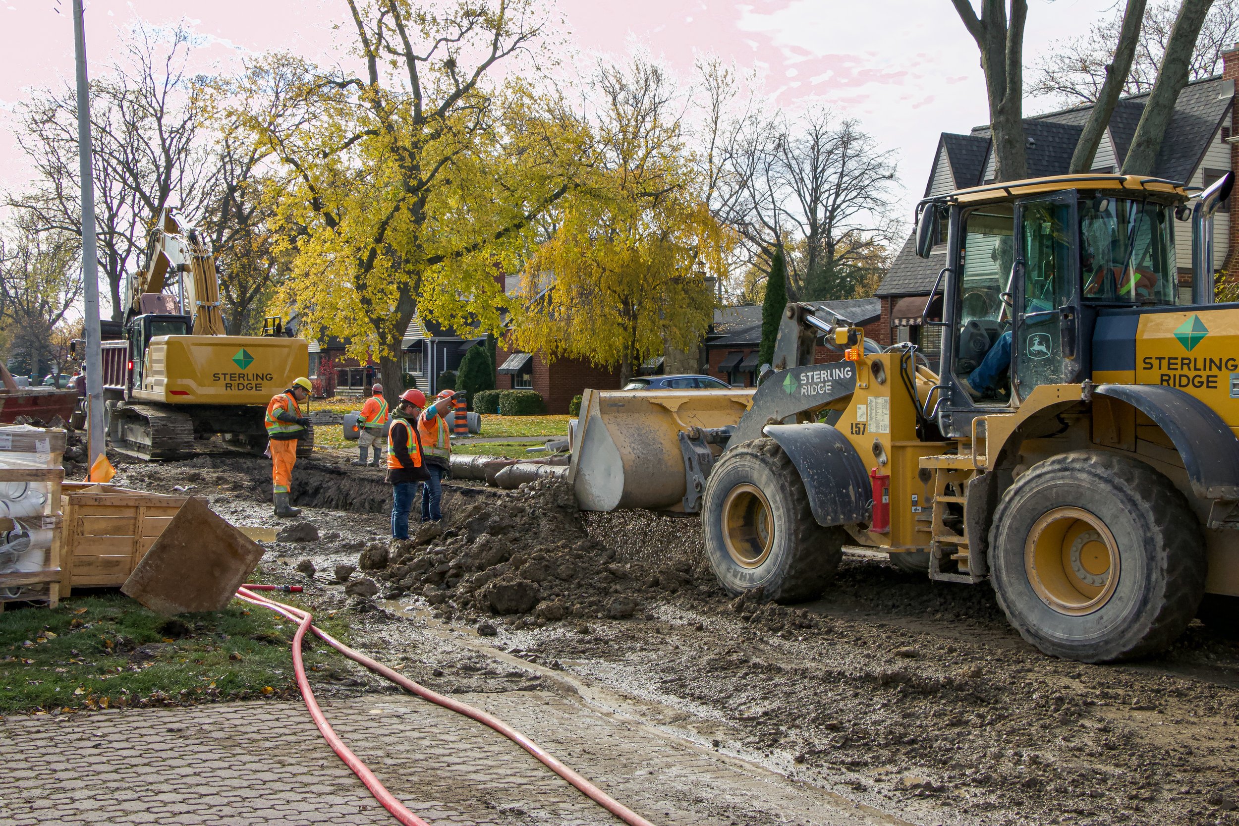 A group of workers working on a road.