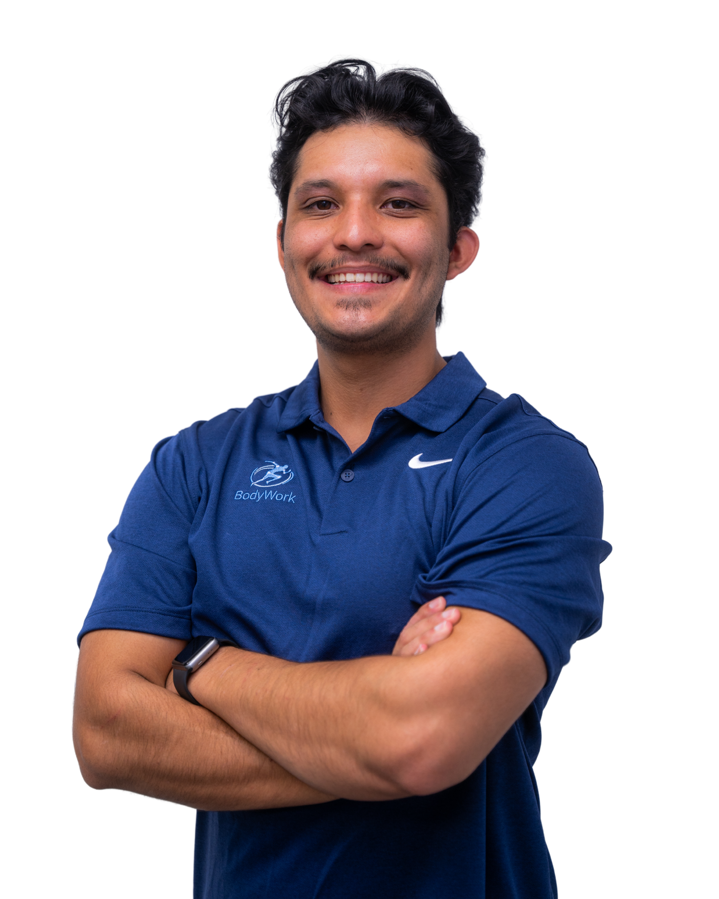 A smiling man with dark hair, wearing a blue polo shirt with 'BodyWork' logo and a Nike swoosh, crossing his arms, isolated on white background.