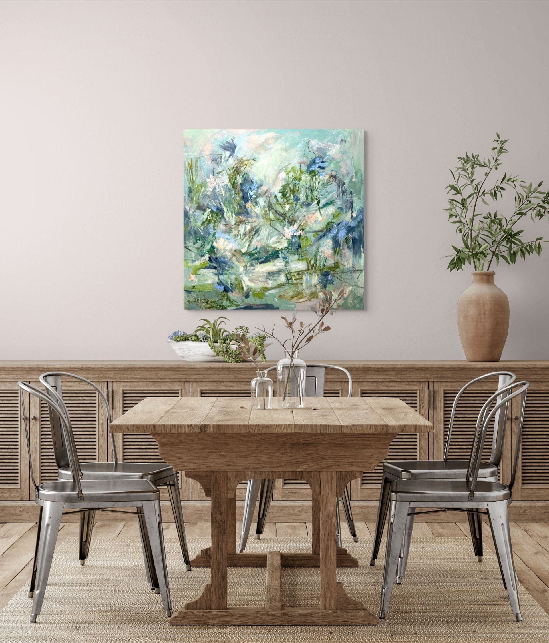 The abstract painting "Wild at Heart" blends the warmth of nature with wood and metal features of a dining room.