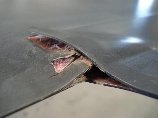 Trailing edge spar is delaminating under the trim tab