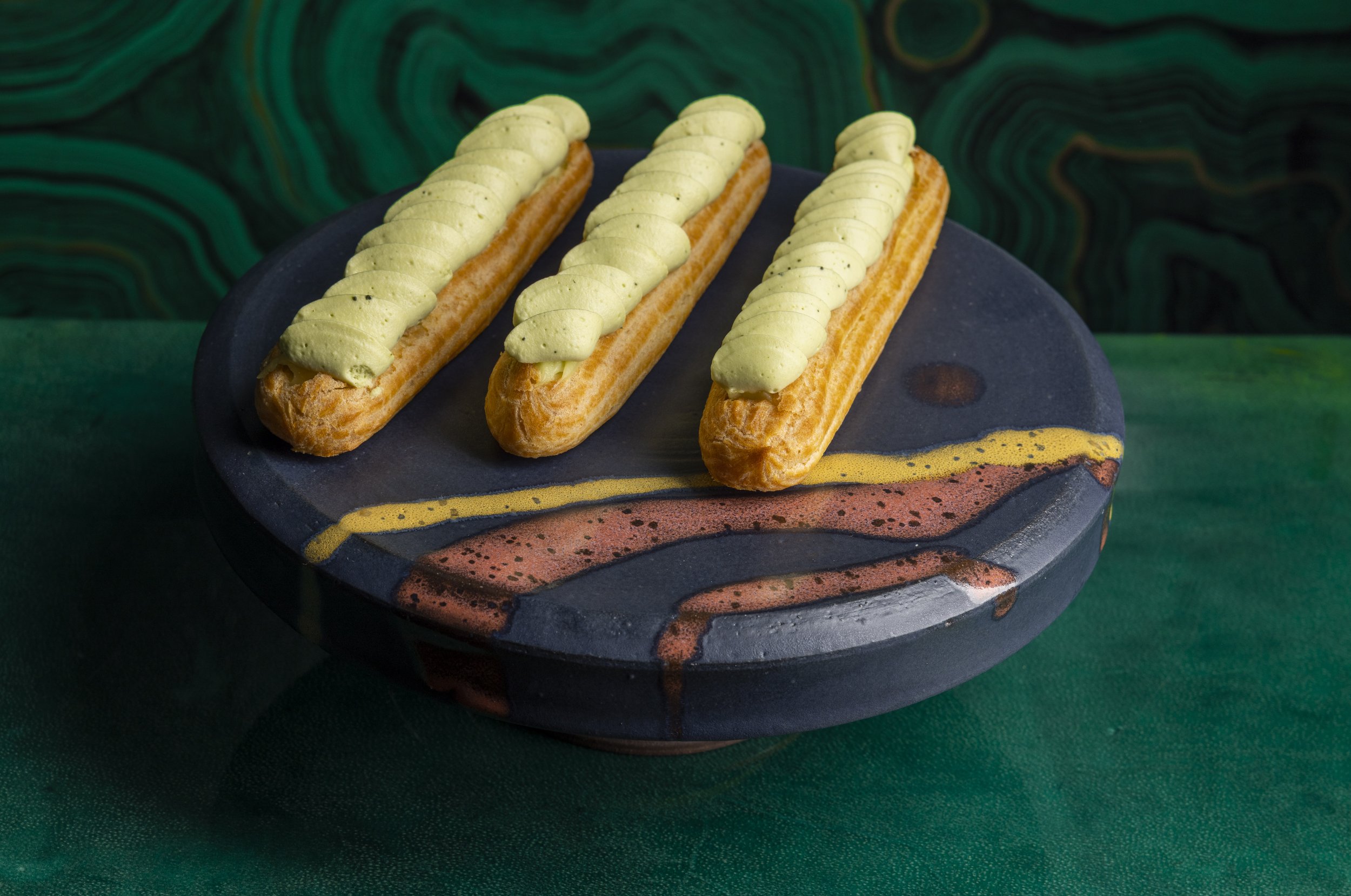 Midnight Campfire cake stand with eclairs