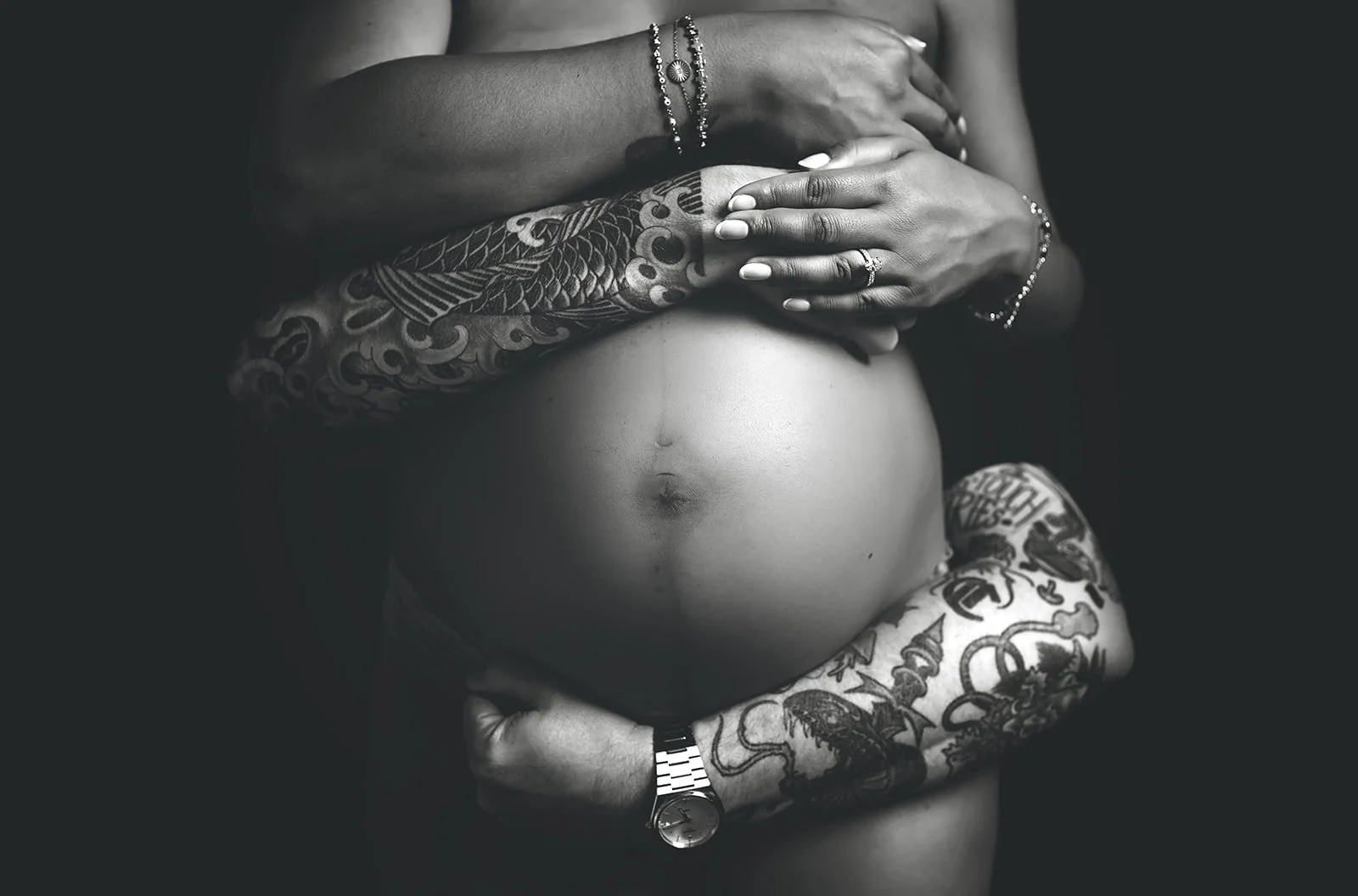 dramatic black and white baby belly shot in studio in Monroe, NC