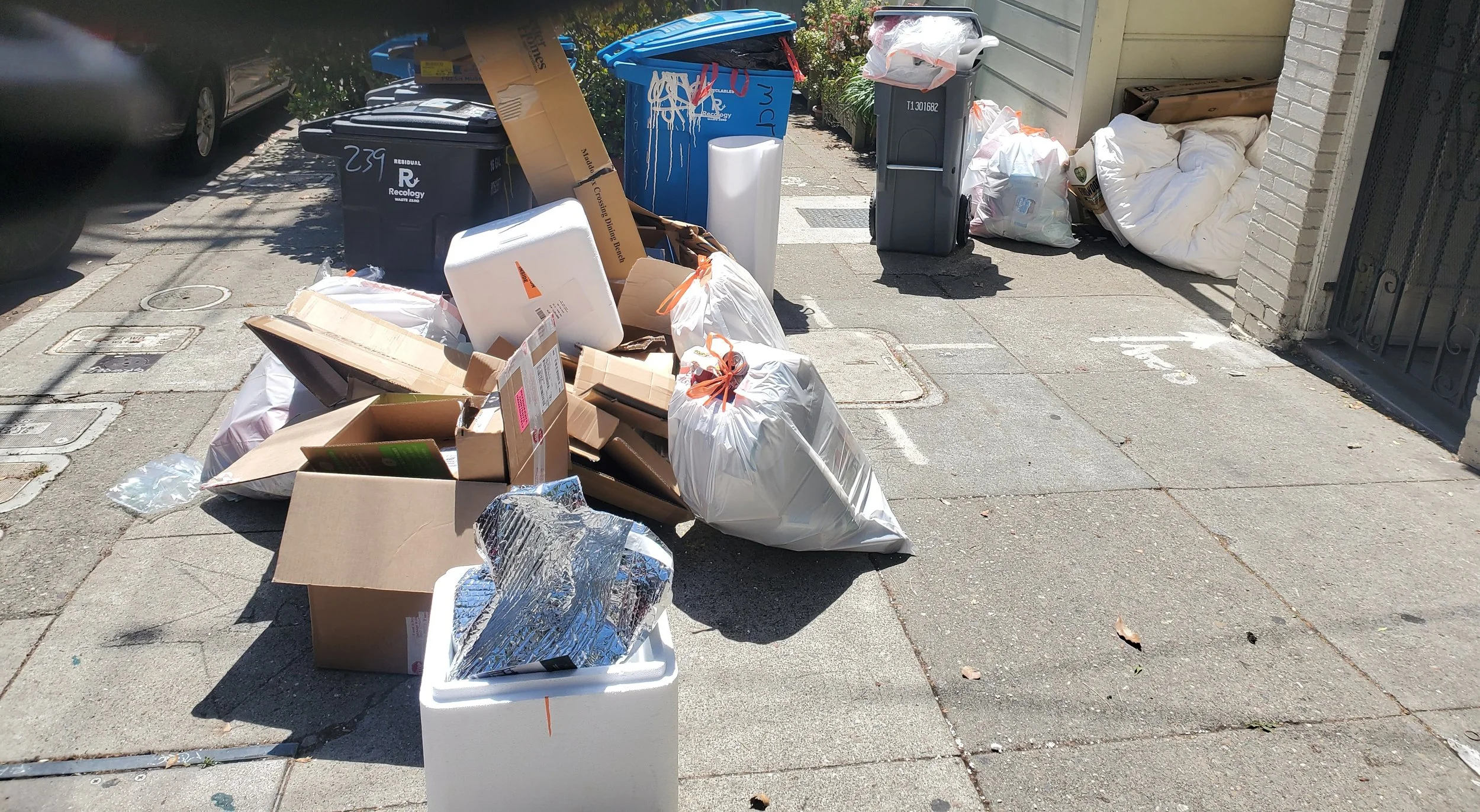 Bags and boxes of general trash staged for curbside junk removal