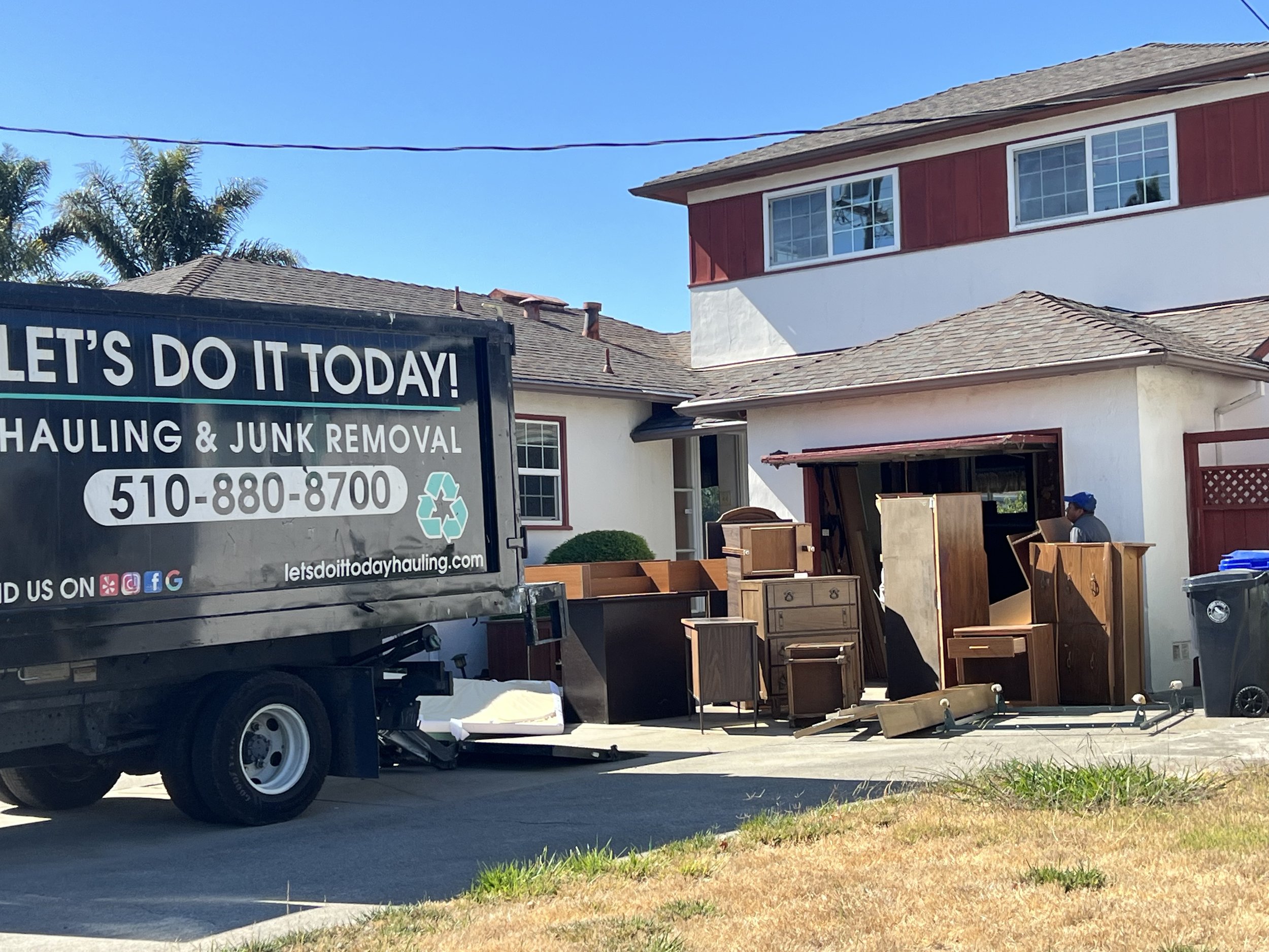 Let's Do It Today crew removing furniture from a residential home in the Bay Area