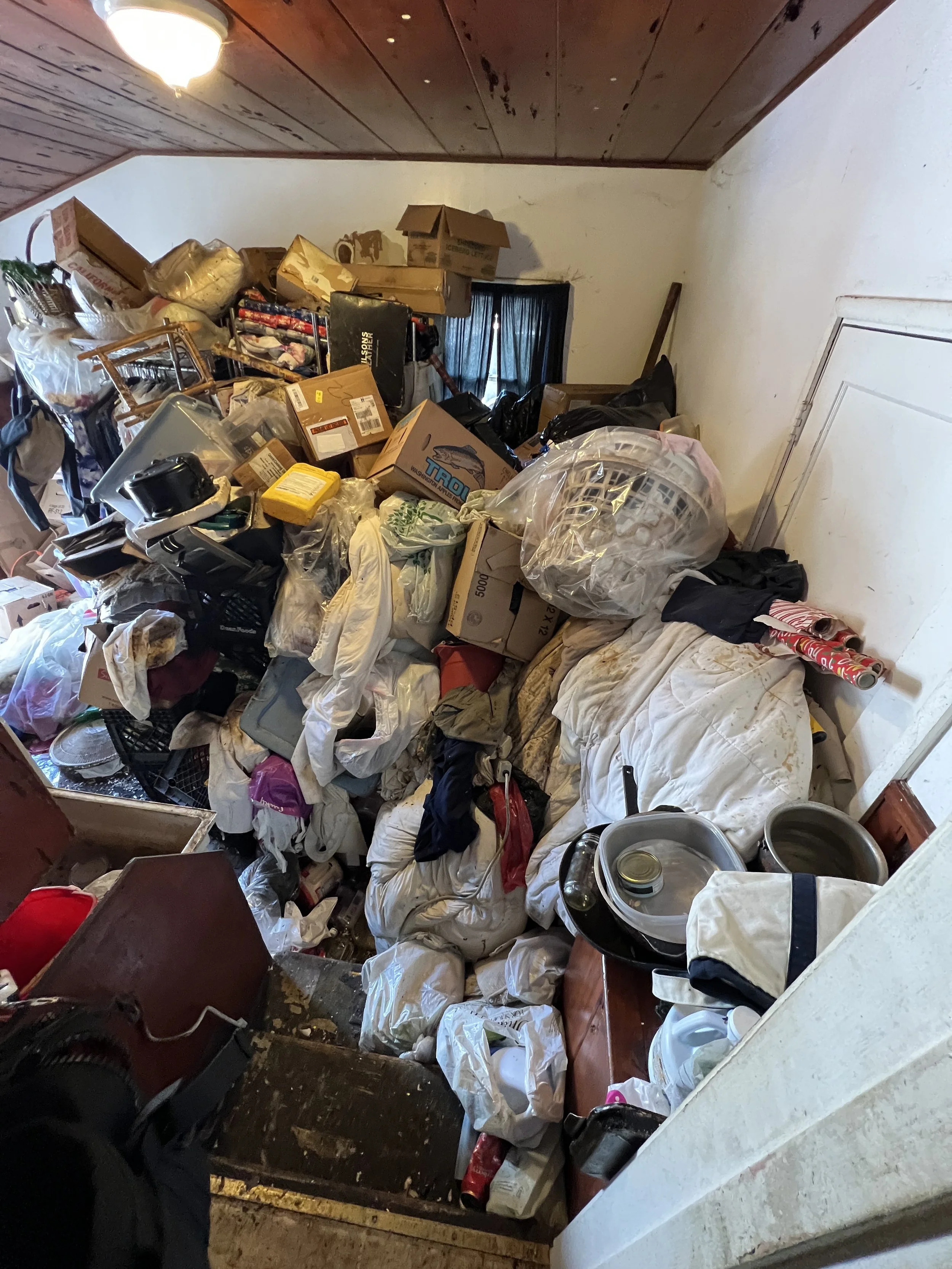 Piles of bagged trash cleared during a hoarding cleanout in the Bay Area