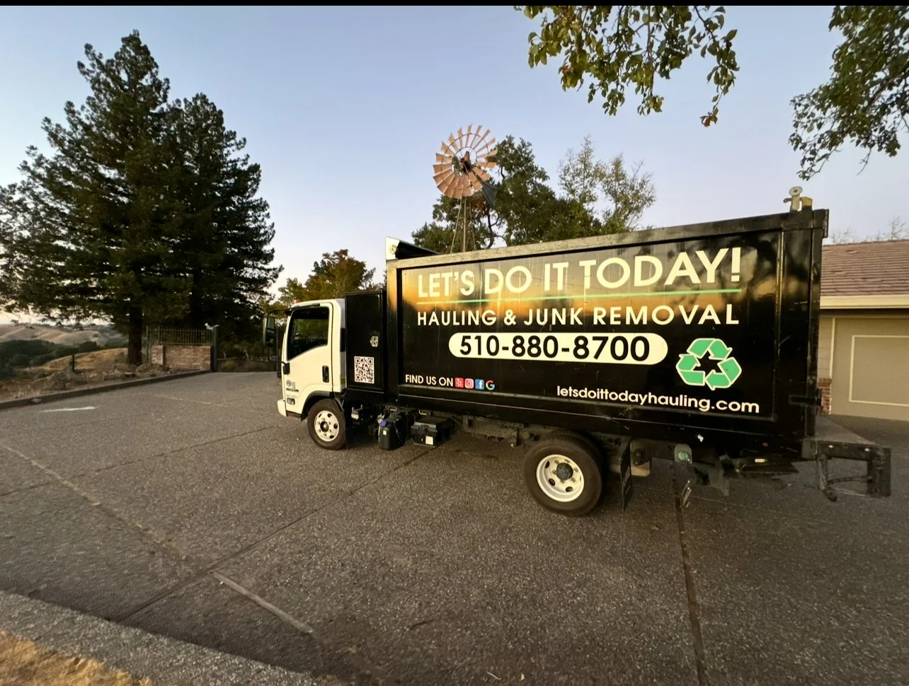 Let's Do It Today junk removal truck at a residential Bay Area property