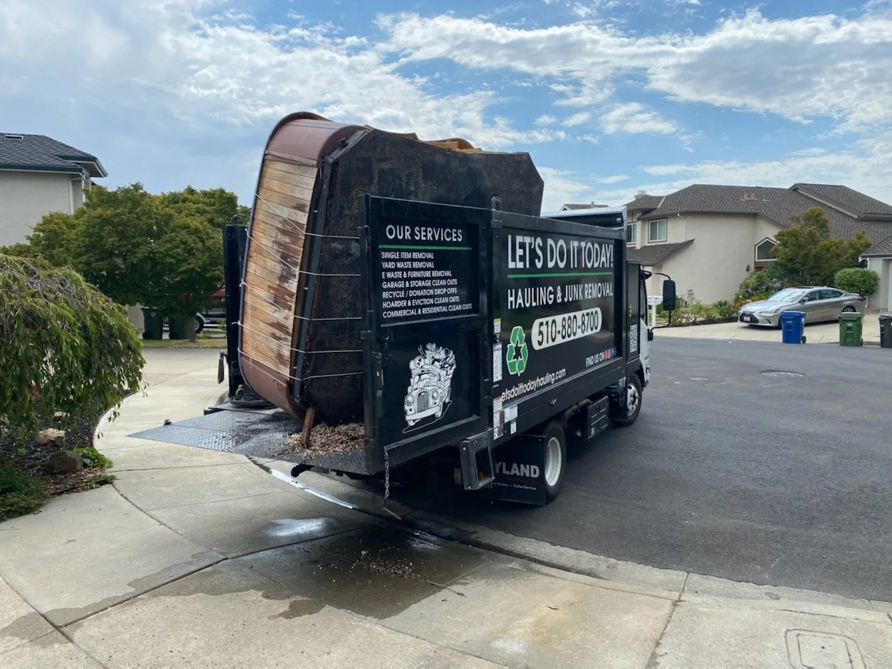 Let's Do It Today truck hauling away a hot tub in the Bay Area