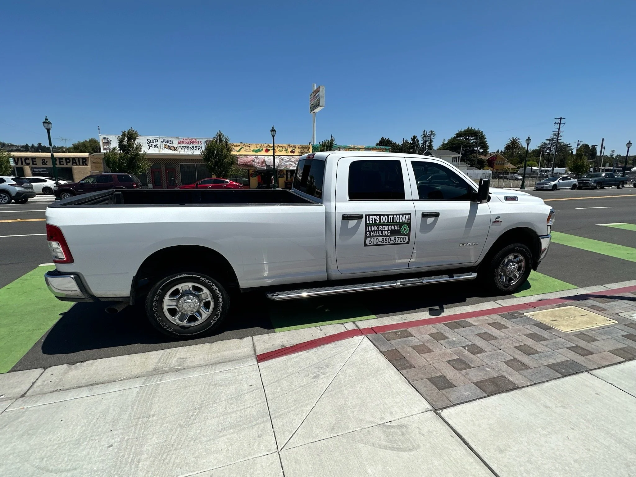 Let's Do It Today Hauling pickup truck parked on a Bay Area street