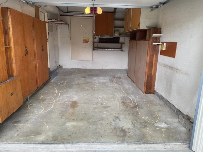Garage floor cleared of carpet and flooring debris by Let's Do It Today