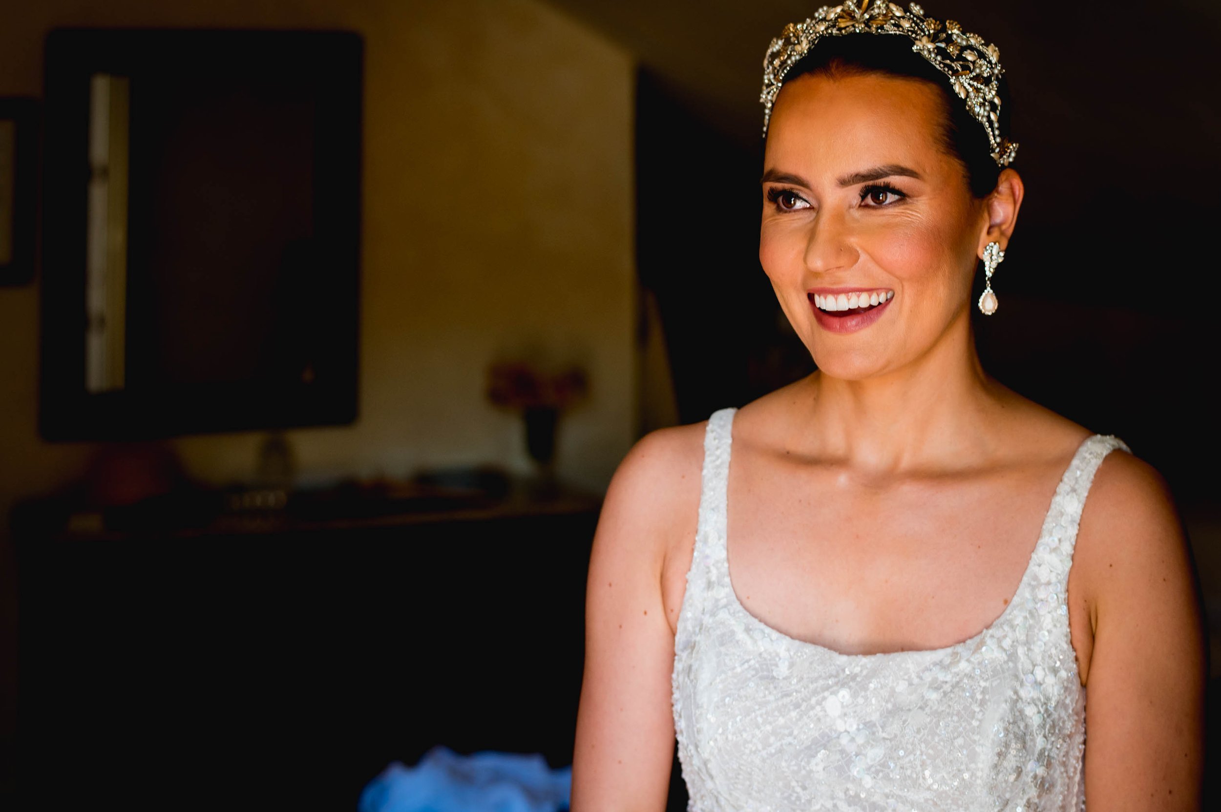 bride smiling in her wedding dress and tiara