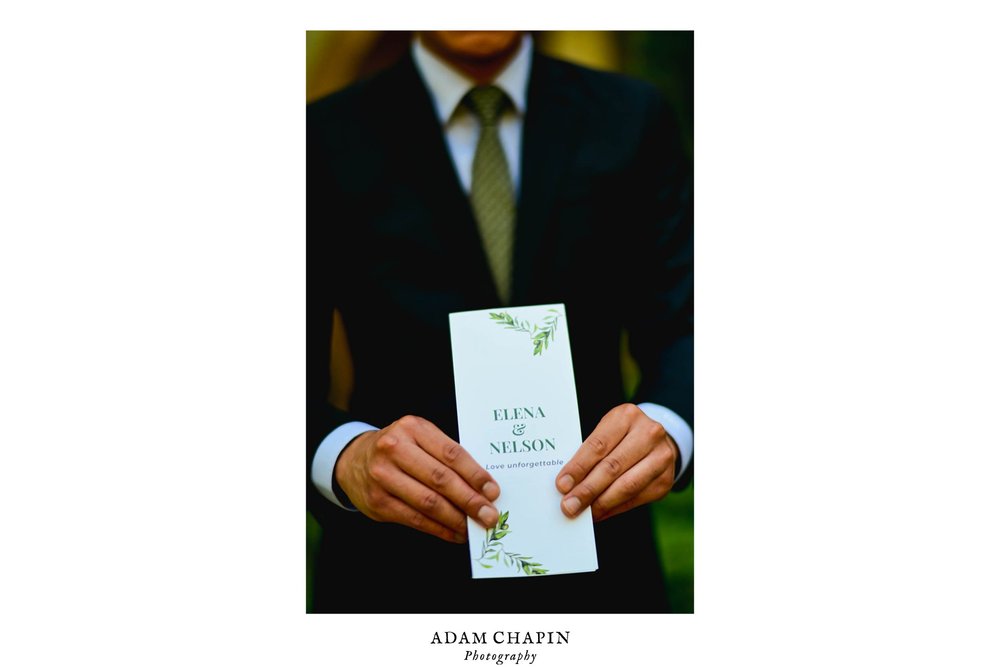 wedding guest holding the wedding program before the ceremony