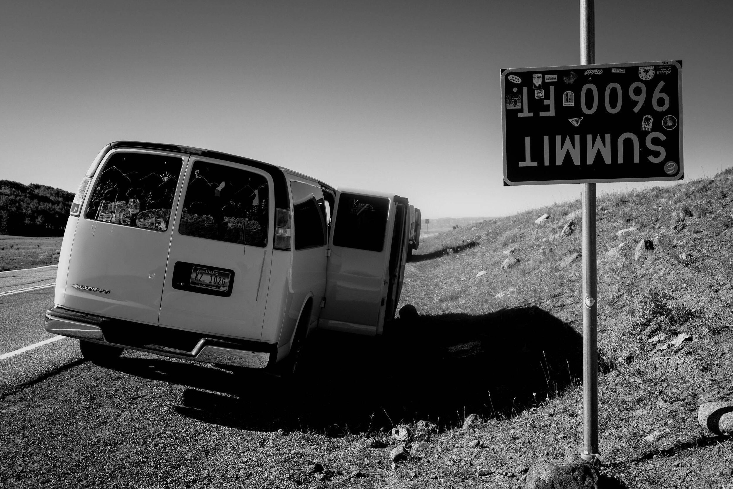 a van parked at the highest point on route 12 in utah 