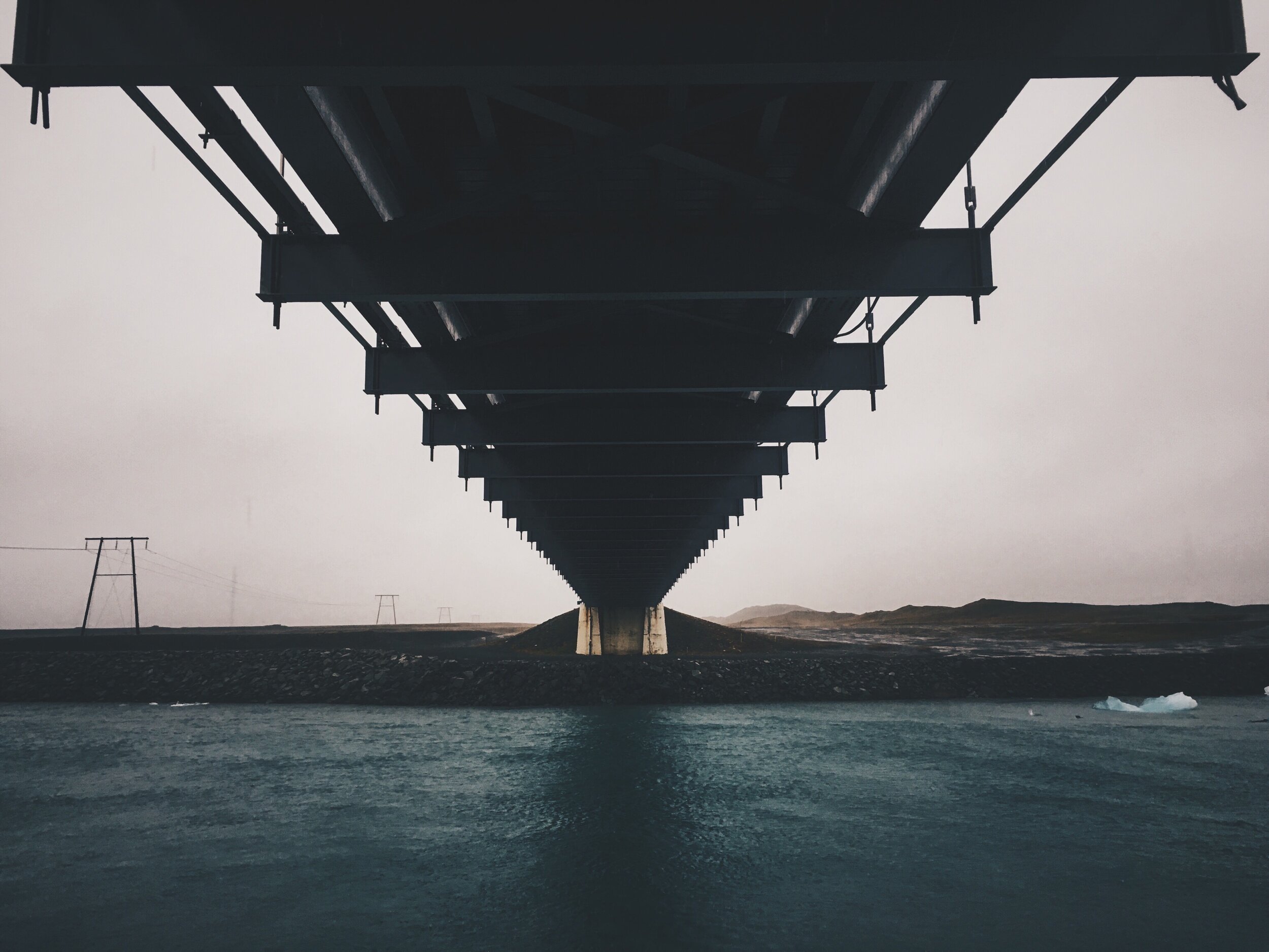a bridge heading towards Hof Iceland
