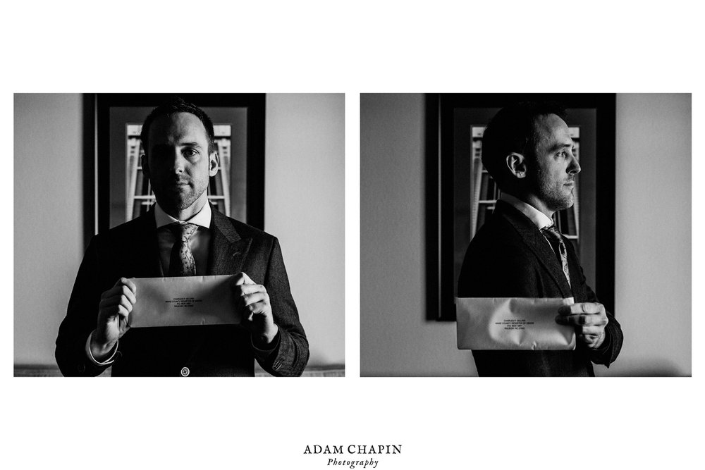 groom posing with marriage certificate like mugshot