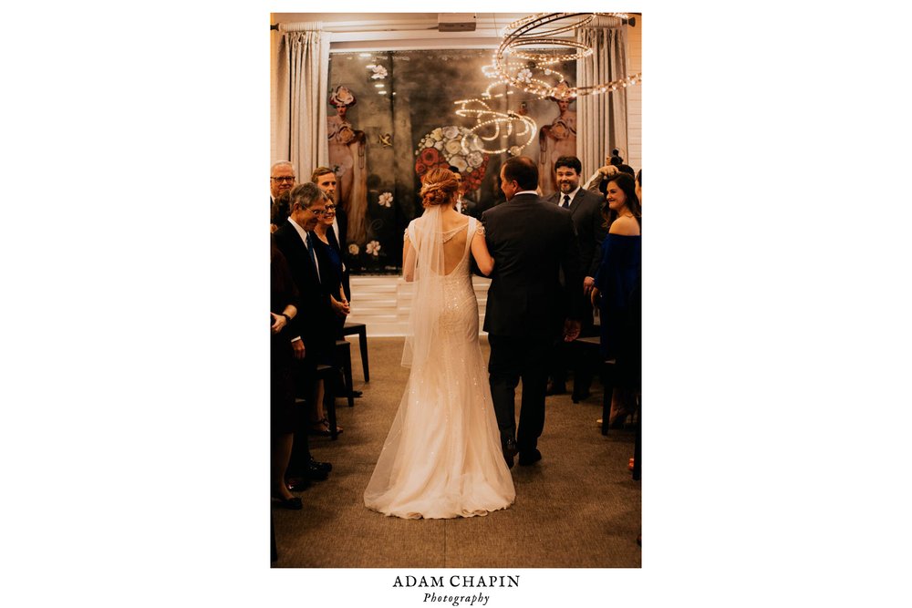 bride and father of the bride walk down the aisle during the wedding ceremony at vidrio