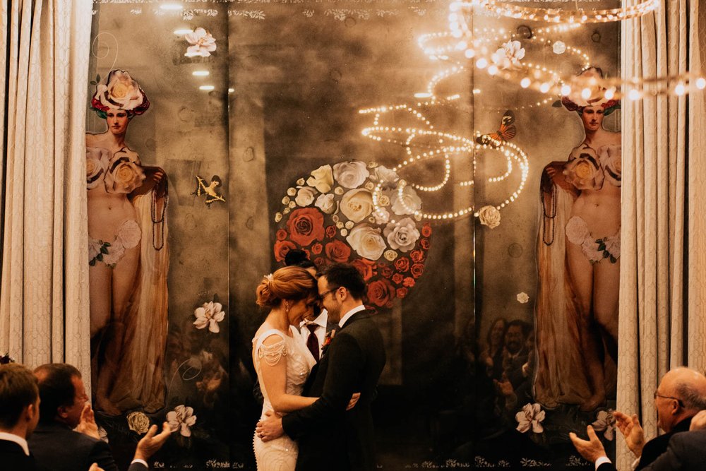 bride and groom hold each other during their ceremony