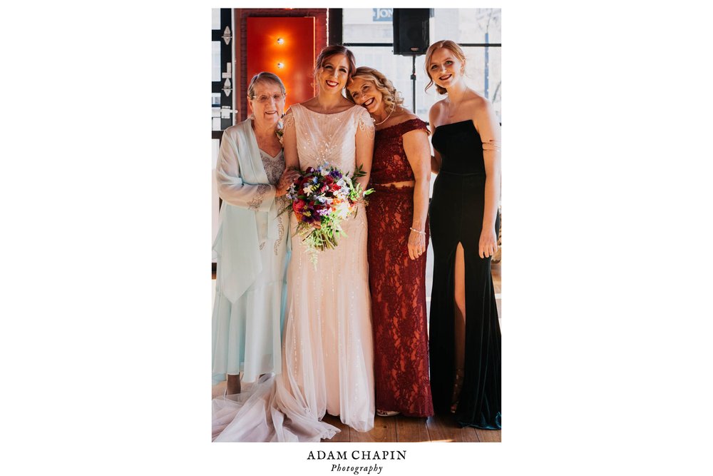 bride poses with the women of her family