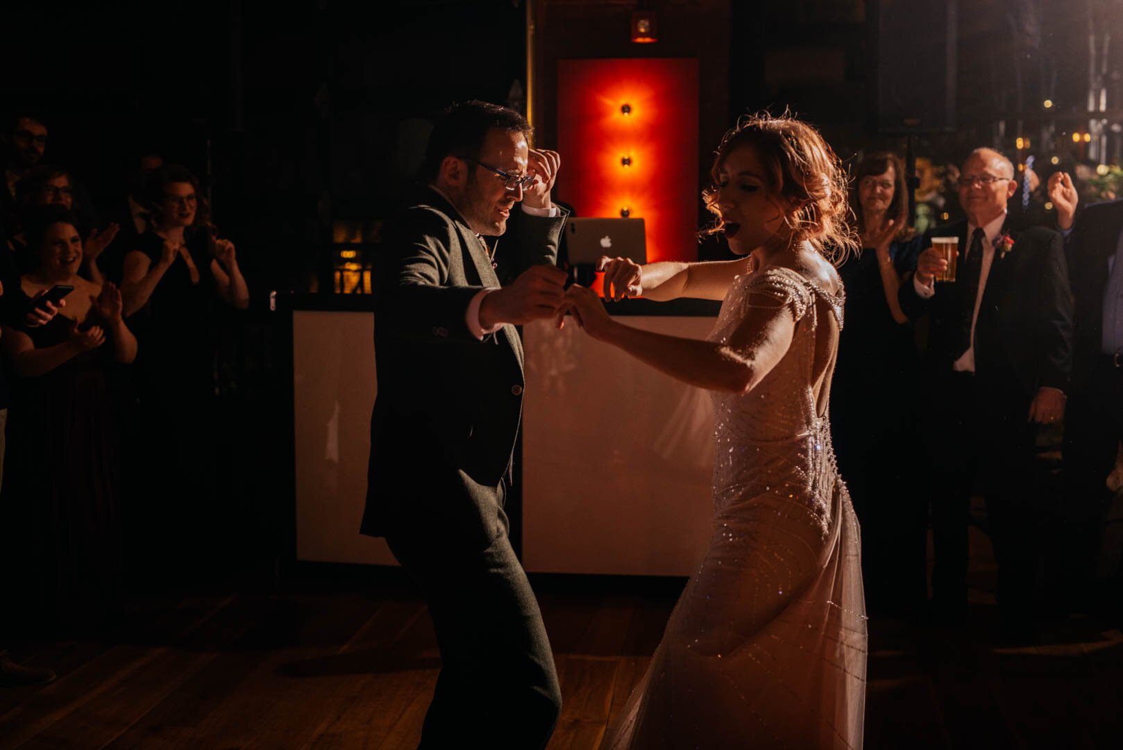 bride and groom getting down to their first dance
