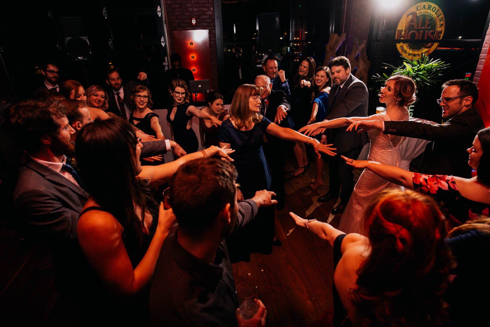 groom and grooms mother dance as the wedding guests get involved