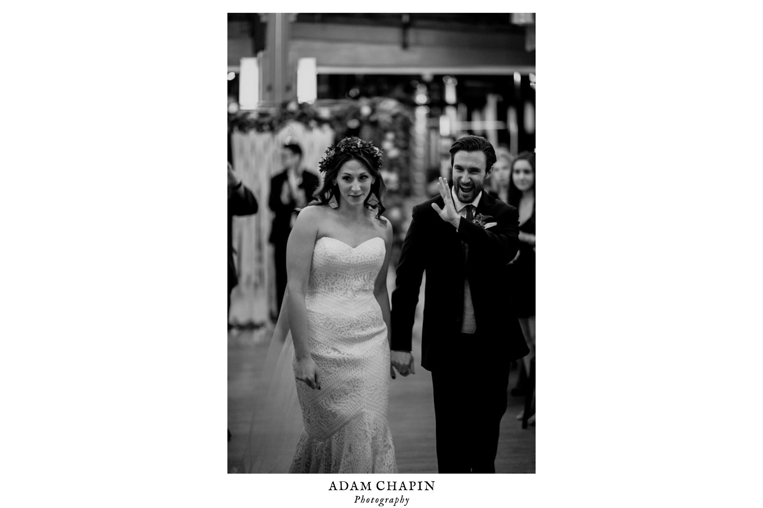 the bride and groom happily walking back during their recessional after their ceremony