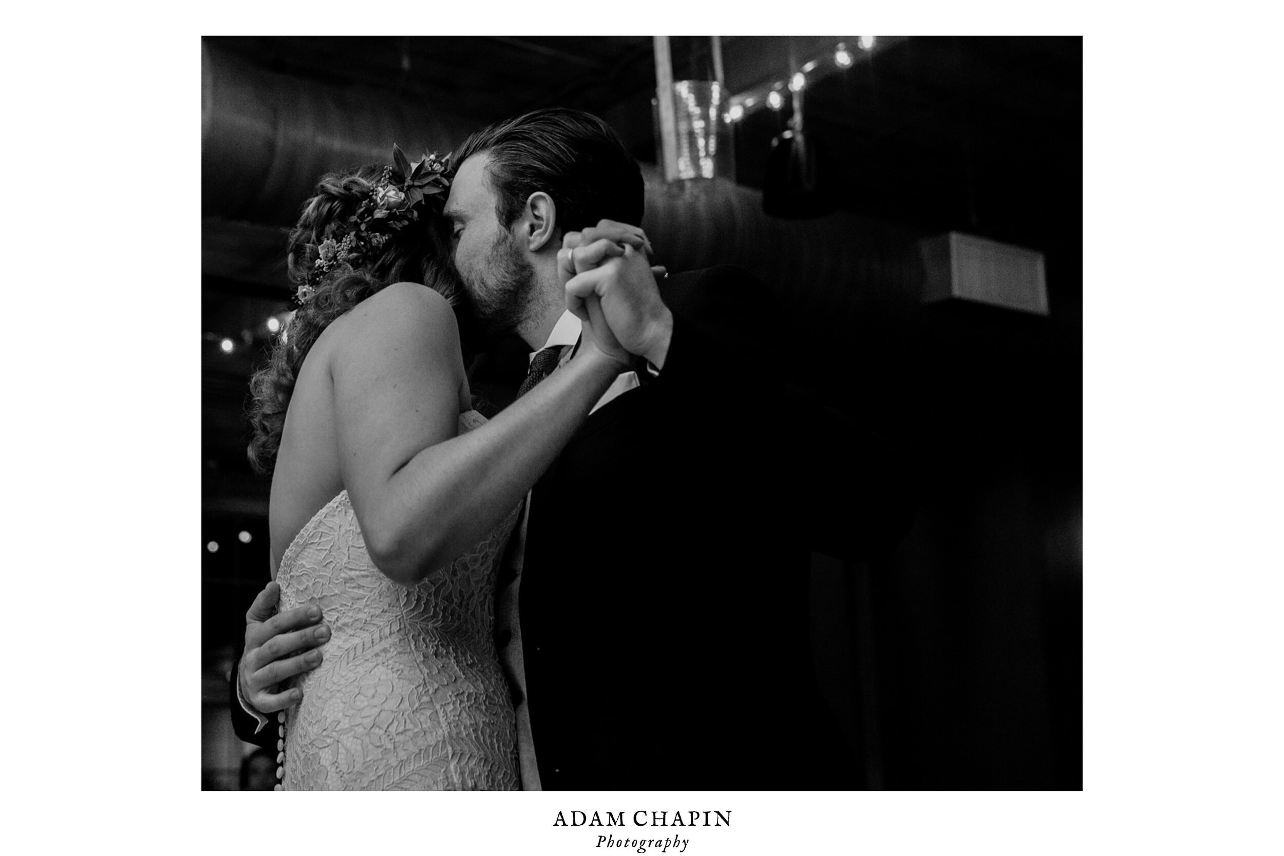 the groom kissing the bride during their first dance