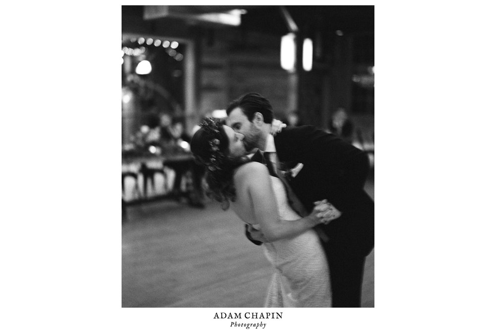 the bride and groom sharing a passionate kiss and dip during a dance