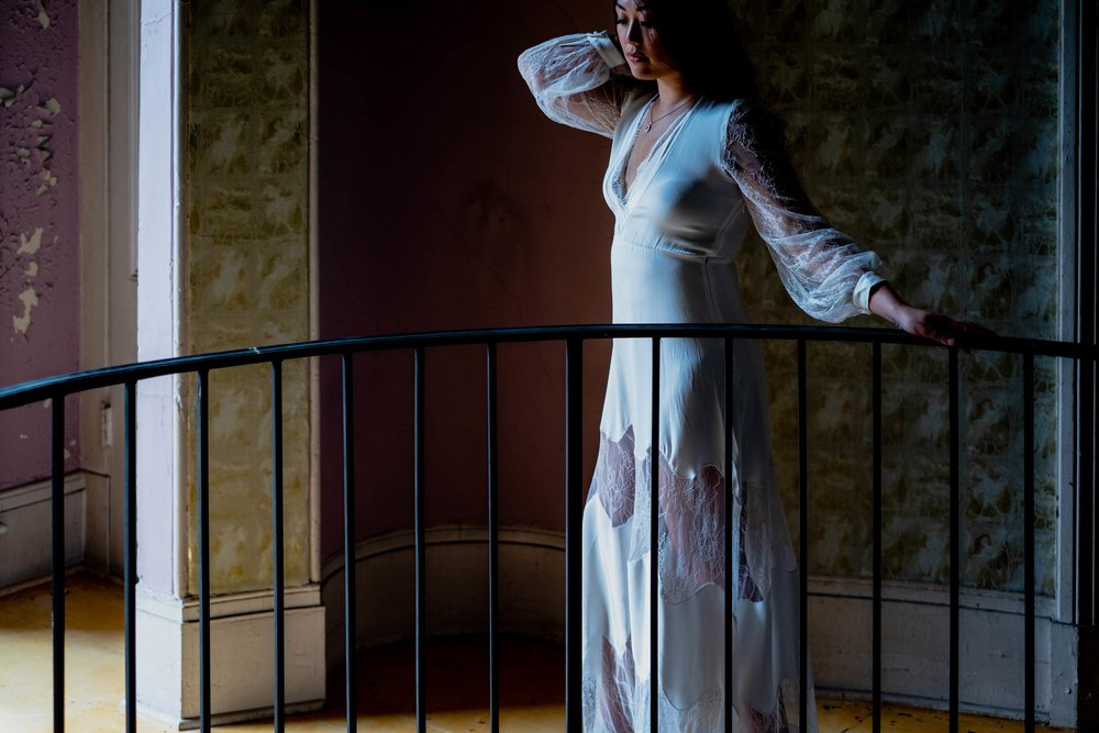 bride walking around the upstairs of the Montfort House in Raleigh, NC