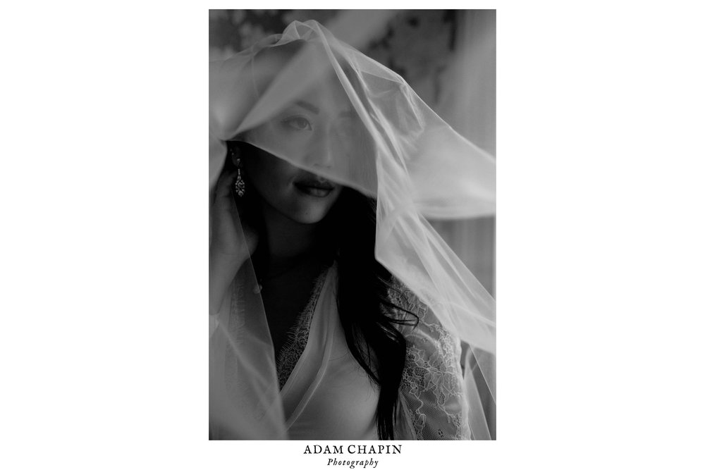 black and white portrait of bride wearing her veil