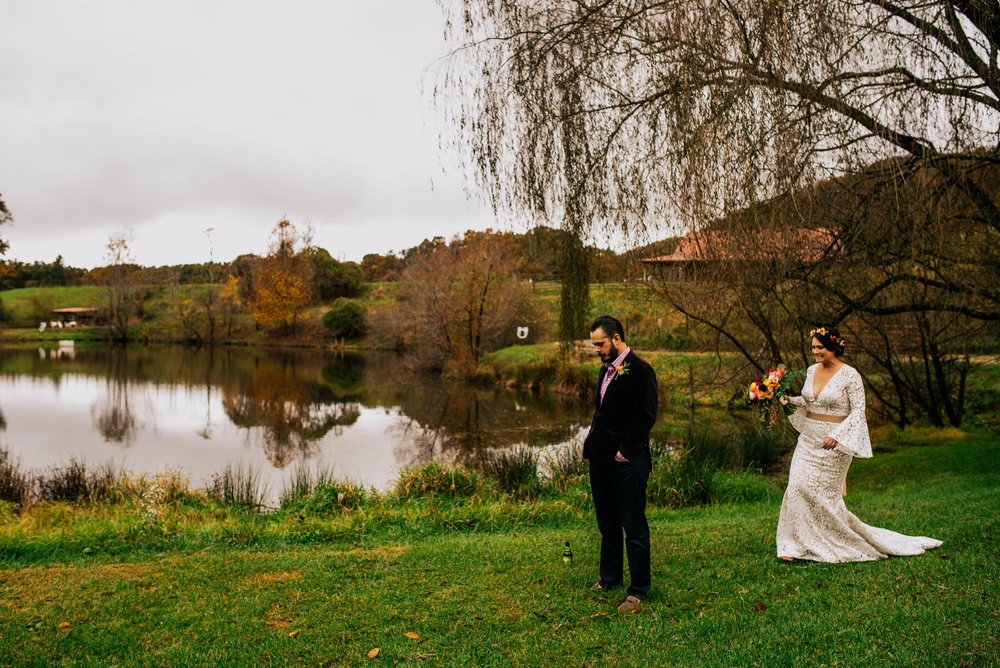 bride coming up behind her groom before the first look