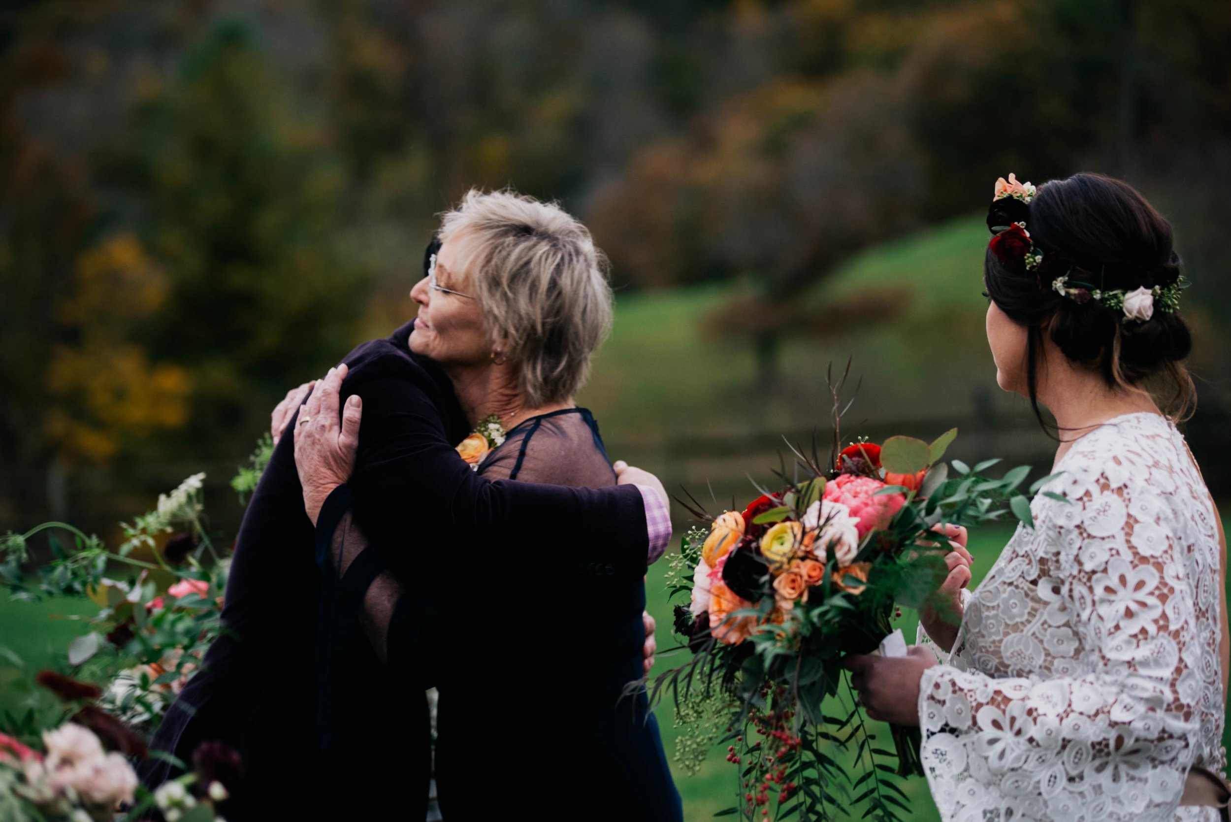 mother of the bride hugging the groom at the beginning of the ceremony