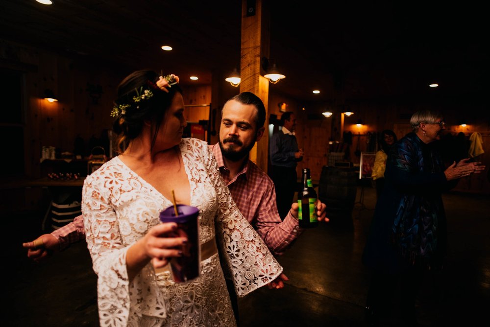 bride and groom dancing together