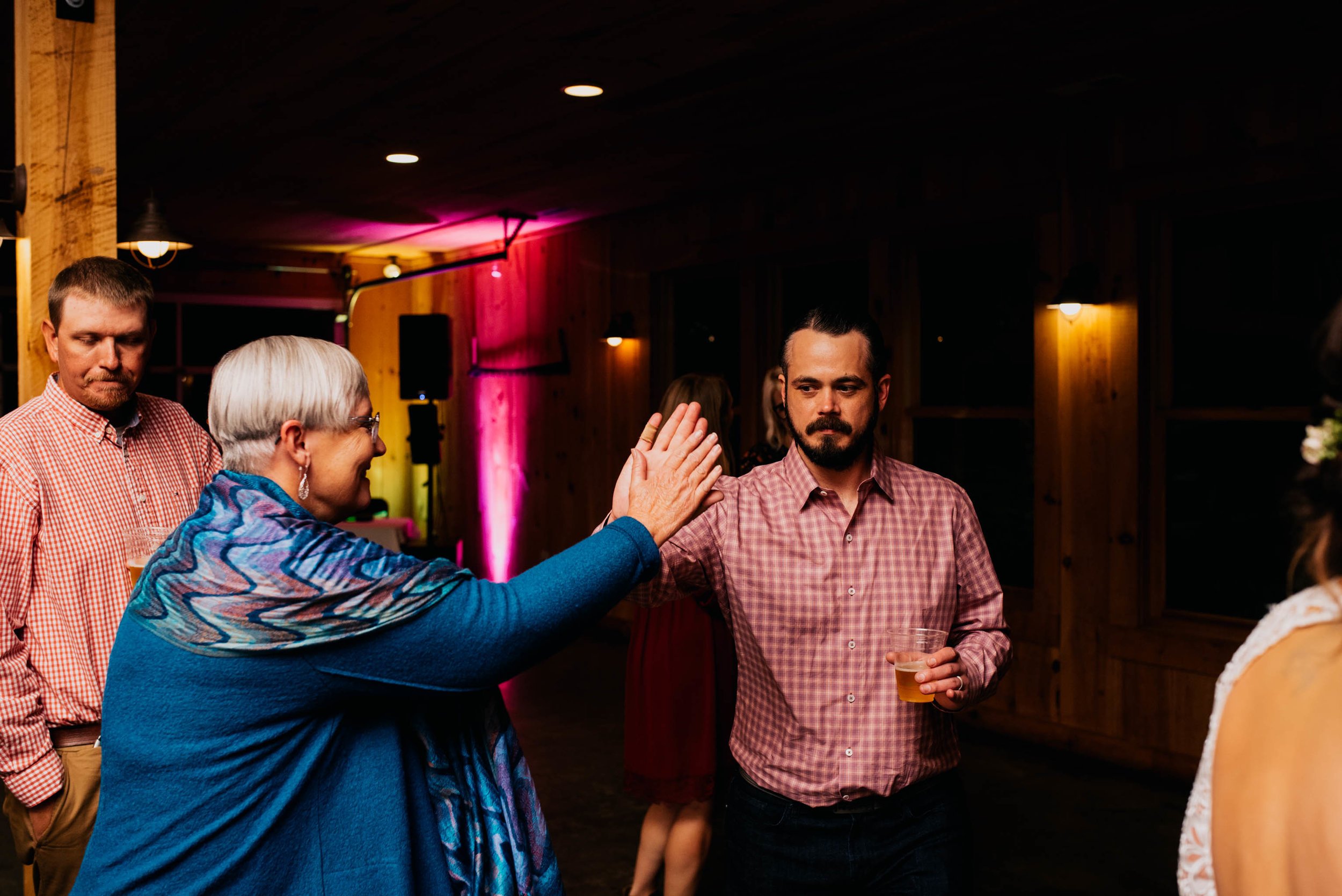 groom high-fiving his aunt