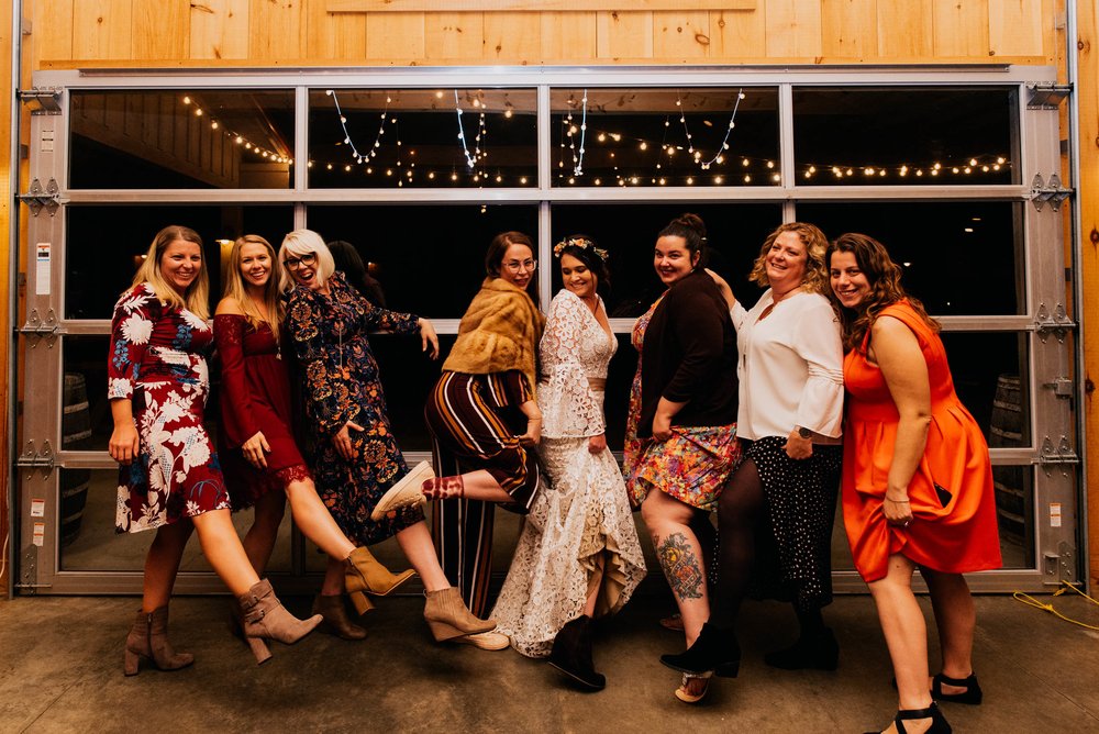 bride and all of her friends showing some leg together at the end of the night