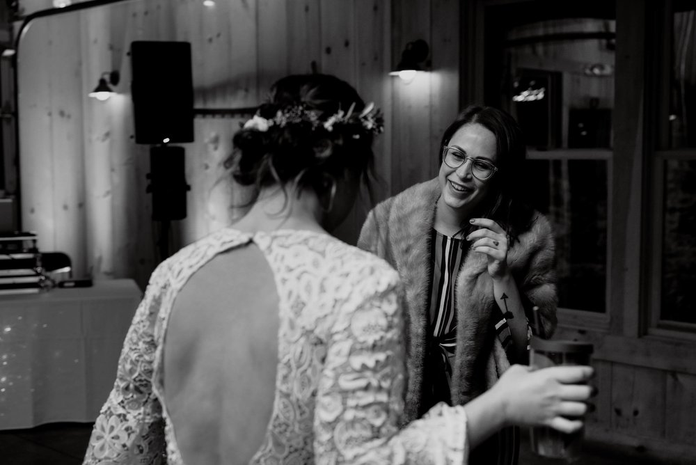 bride and the grooms sister dancing together during the reception