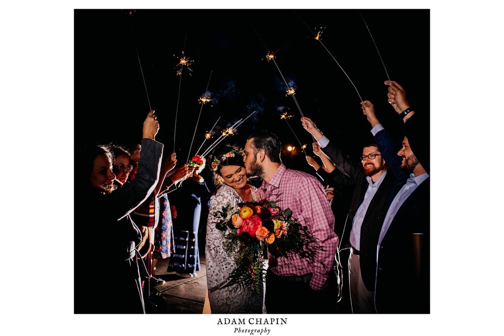 bride and groom escape during the sparkler exit at the end of their wedding night