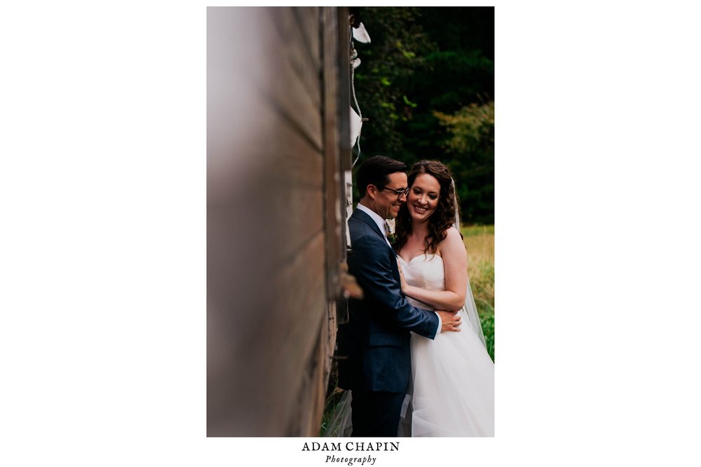 bride and groom laughing during photos before their wedding ceremony