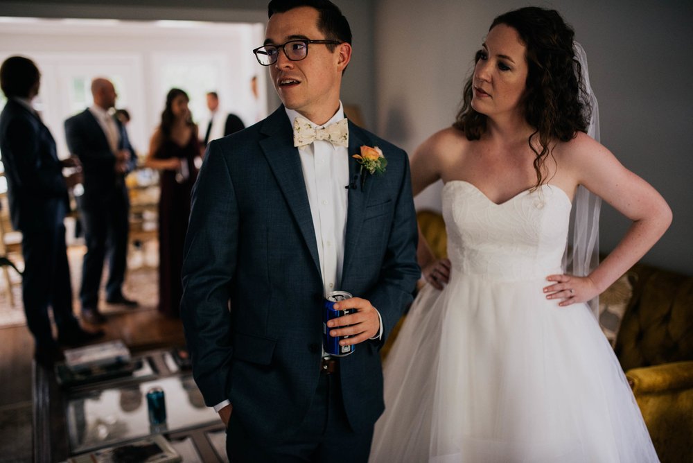 bride and groom talking with guests just before the wedding ceremony