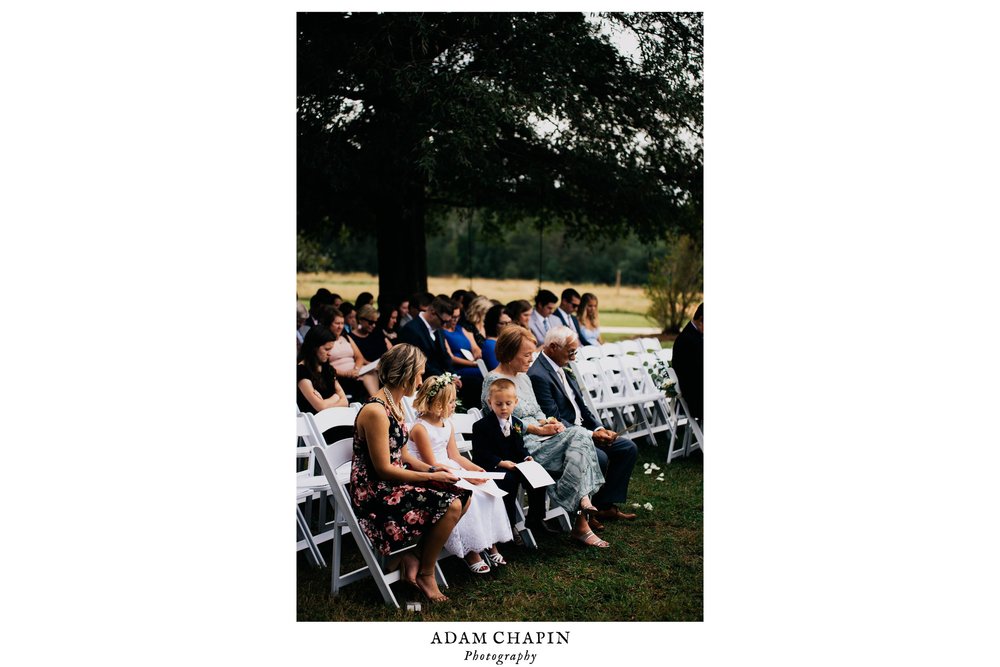 bride and grooms family looking on during their wedding ceremony