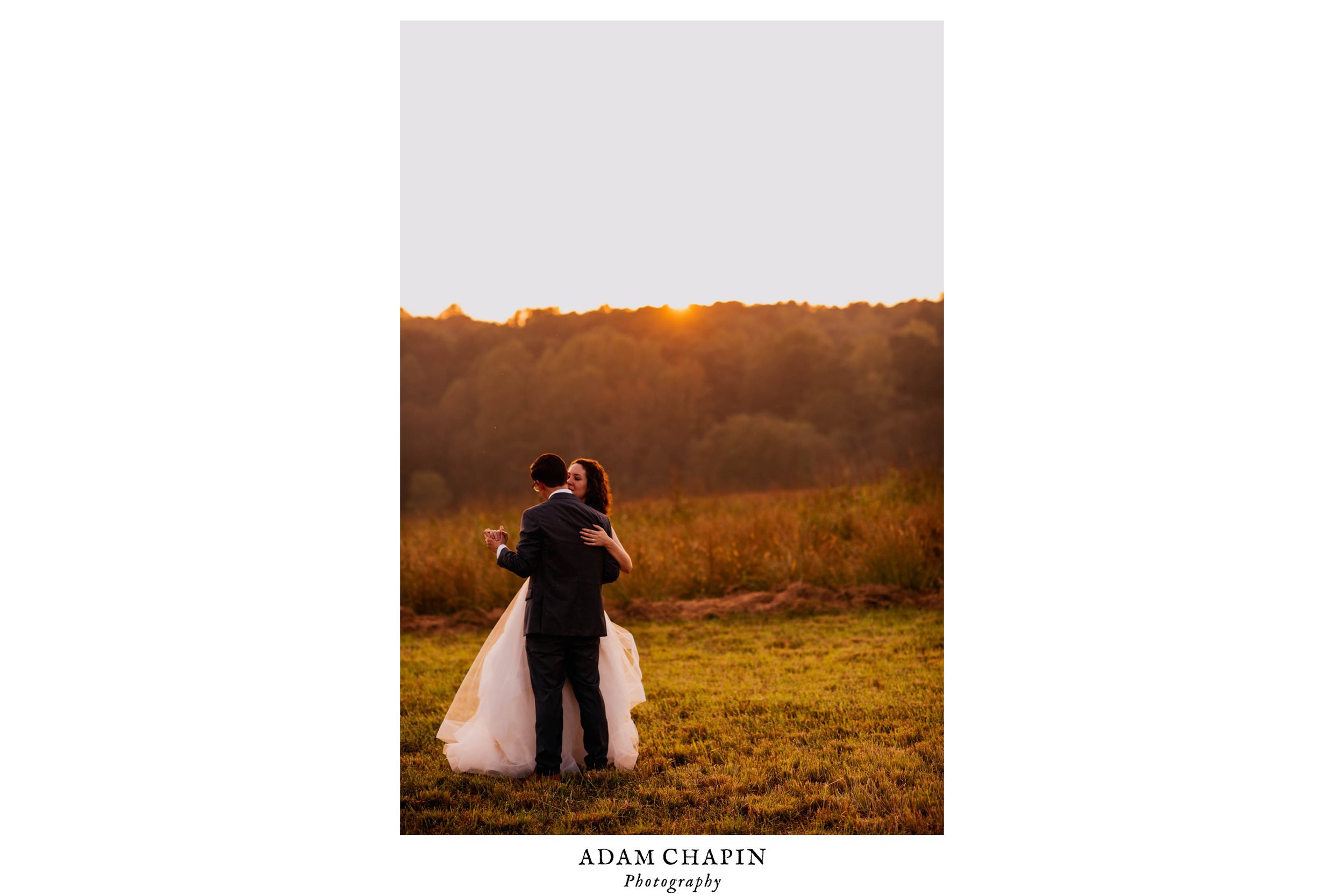 bride and groom dancing in a field in the sunset during their wedding day