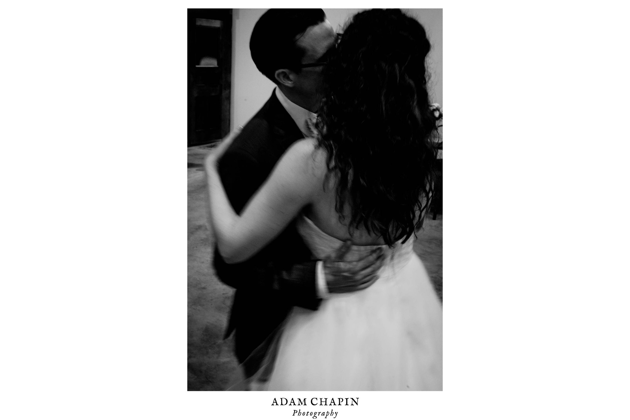 black and white photo of bride and groom dancing at their wedding reception