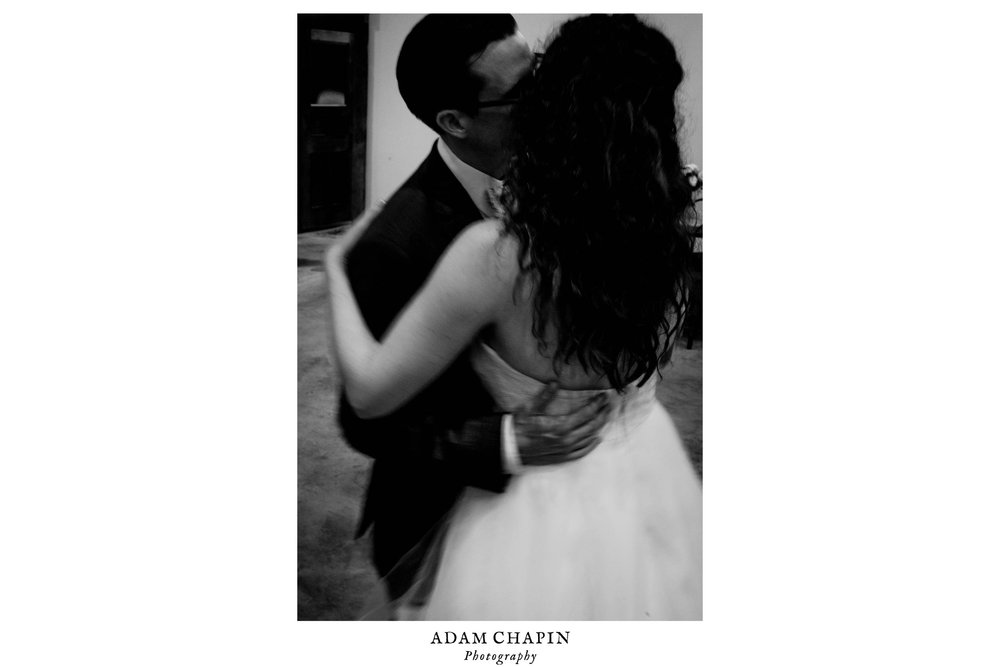 black and white photo of bride and groom dancing at their wedding reception